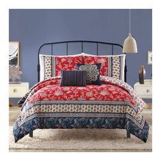 a bedroom with blue walls and red bedding