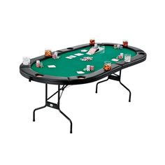 a black table with poker cards and drinks on it, ready to be used as a game