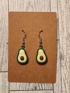 These are simple dangle earrings with green avocado charms. The components are nickel-free and comfortable for long wear. Everyday Green Dangle Teardrop Earrings, Green Teardrop Dangle Earrings For Everyday Wear, Everyday Green Teardrop Dangle Earrings, Casual Green Dangle Earrings, Casual Green Drop Earrings, Casual Green Everyday Earrings, Ag Doll House, Avocado Earrings, Avocados From Mexico