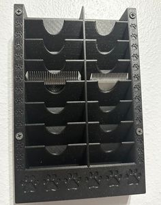 a black object hanging from the side of a wall with holes in it's sides