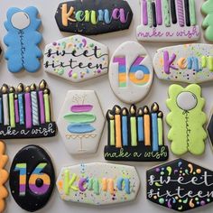 decorated cookies are arranged in the shape of numbers and birthday candles for someone's 16th birthday