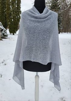 READY TO SHIP Soft and elegant womens poncho, perfect lightweight cover-up for any kind of seasons or occasions. Because of natural alpaca wool and super kid mohair, this ladies poncho is warm and breathable.  Material : Alpaca wool 44%                   Super Kid mohair 36%                   Polyamide 20%                                          Color: Grey, light blue              Size: One size for S,M,L,XL, 2XL. For more knitted accessories and clothing, visit my shop: https://www.etsy.com/s