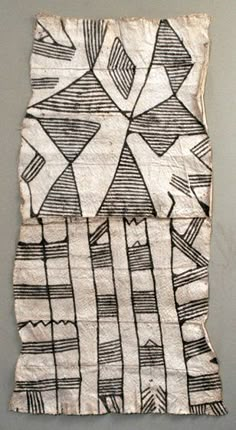 a piece of cloth with black and white designs on it