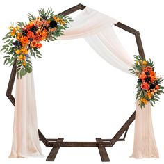 an arch decorated with orange flowers and white draping for a wedding or ceremony