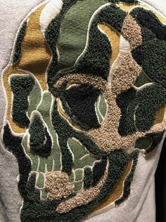 a t - shirt with a camouflage skull on it