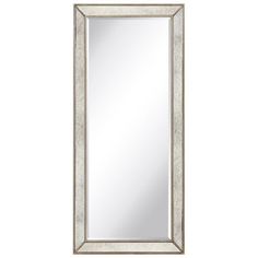 the large mirror is made from wood and has a silver frame with beading on it