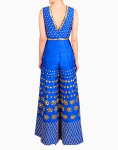 Featuring an electric blue raw silk jumpsuit embellished with gold sequins and acrylic mirrors paired with a gold sequined embroidered belt. Fabric: Raw Silk Care: Dry Clean Only Kiara Advani Jumpsuit, Traditional Jumpsuit Indian, Jumpsuit Outfit Wedding, Embellished Jumpsuit, Embroidered Jumpsuit, Mehendi Outfits, Indian Fashion Trends, Gown Party Wear, Jump Suits