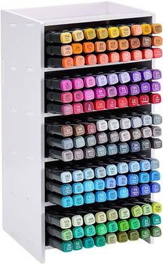 a multi - tiered storage rack with many different colored paint samples on it's sides