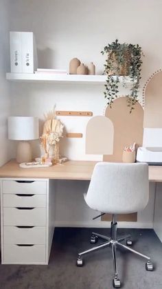 a white chair sitting in front of a wooden desk