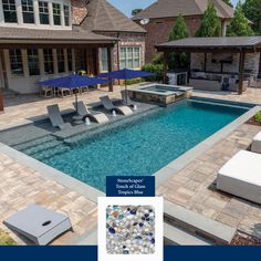 a swimming pool with lounge chairs and umbrellas in front of the home's outdoor living area