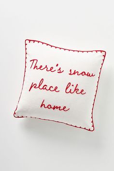 there's snow place like home embroidered pillow cover in red and white on an off - white background