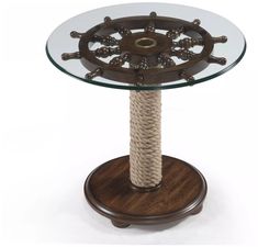 a glass and wood table with rope on top