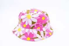 SUMMER BUCKET HAT * PINK VINTAGE FABRICK with FLOWERS * TWO SIDES bucket hat. ( WHITE or STRIPED). * Handmade and recycled from A to Z in Montreal.  Sizes Informations     SMALL/MEDIUM : 52 à 57 cm. MEDIUM : 54 à 60 cm. The circumference is measured with a metric ribbon around the head passing to the center of the forehead, the tip of the ears and the back of the skull. PLEASE TAKE THE MEASUREMENT OF YOUR HEAD. NO REFUND WILL BE ACCEPTED.  DELIVERY: from 1 to 2 weeks  Do not hesitate to contact Reversible Pink Bucket Hat For Beach, Reversible Pink Bucket Hat For The Beach, Retro Pink Brimmed Hat, Retro Pink Wide Brim Hat, Vintage Bucket Hat For Vacation, One Size Fits Most, Vintage Brimmed Bucket Hat For Beach, Vintage Brimmed Bucket Hat For Summer, Spring Reversible Cap Sun Hat, Vintage Brimmed Summer Bucket Hat