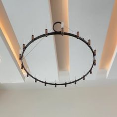 a circular light fixture hanging from the ceiling