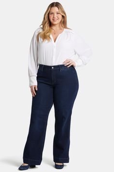 One way to stand out is to rock a bold, trendsetting pair of jeans. The Teresa Trouser Jeans in Plus Size by NYDJ don’t just stand out—they steal the show. Our Lift Tuck® Technology is made to help you keep your shape, with a proprietary slimming panel with a patented criss-cross design that smooths and sculpts. These trouser jeans feature a wide leg opening, non-functional back welt pockets and a zip fly with button closure. This jean is made with earth-friendly methods that result in reduced consumption of water, chemicals and/or energy. | NYDJ Women's Teresa Trouser Jeans In Plus Size in Burbank Wash, Size: 22W | Denim Cross Design, Rock A, Cross Designs, Earth Friendly, Trouser Jeans, Welt Pockets, Welt Pocket, Criss Cross, Denim Jeans