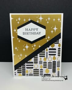 a happy birthday card with gold and black designs