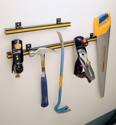 tools are hanging on the wall next to each other