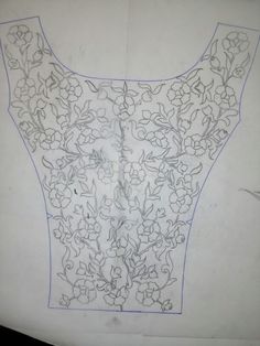 a drawing of a shirt with flowers on the front and back, in white paper