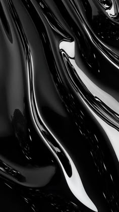 black and white photograph of liquid flowing over each other