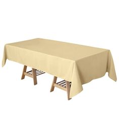 a table covered with a beige cloth