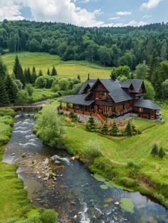 an aerial view of a large log house in the middle of a lush green field