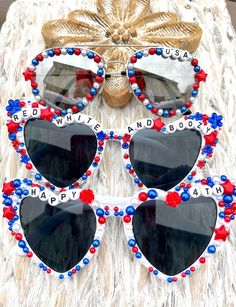 the sunglasses are decorated with red, white and blue beads