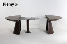 the table is made out of wood and has two legs that are connected to each other