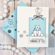 a card with an image of a polar bear on it and the words, thinking of you