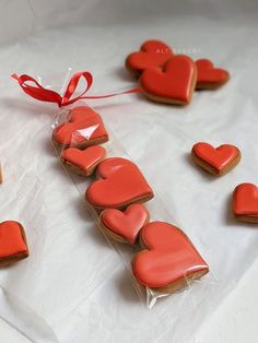 some heart shaped cookies are on a table