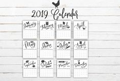 the 2019 calendar is displayed on a white wooden background with roosters and farm animals