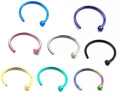 six different colored metal nose rings