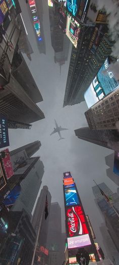 an aerial view of a city with skyscrapers and billboards in new york's times square