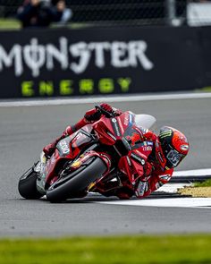 a person riding a motorcycle on a race track