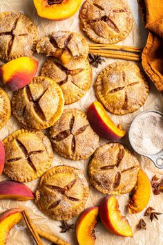 fresh peach pies with cinnamon sugar and anisette on the side next to them