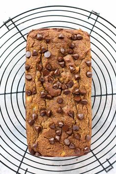 a loaf of chocolate chip banana bread on a cooling rack