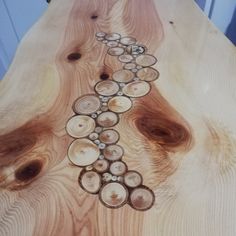 a table made out of wood with circles on it