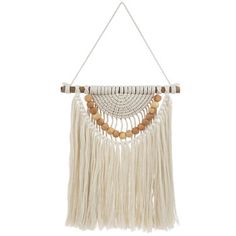 a white wall hanging with beads and tassels on the end, attached to a rope