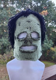 This Zombie Ski Mask is a handmade work of art. Crocheted from acrylic yarn, the details are embroidered on the mask to give it that perfect Zombie look. Made to fit snuggly to be sure to stay in place on all your cold weather adventures.  Personalize your mask by choosing the color and length of the hair. Pictured is the short black hair option. You may choose from short, shoulder-length or bald. Please be sure to specify your choice in the personalization section. Short Black Hair, Short Black Hairstyles, Ski Mask, Costume Hats, Shoulder Length, Acrylic Yarn, Costume Accessories, Headpiece, Zombie