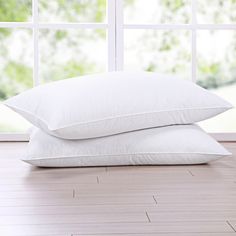 Indulge in the luxurious comfort of the White Goose Nano Down and Feather Blend Pillow Set by Firefly. The pillows are filled with 15% nano down, which is a blend of small dense clusters of super soft down and 85% high loft feathers. European Beds, Goose Down Pillows, Feather Bed, Firm Pillows, Goose Feather, Feather Pillows, Goose Feathers, Pillow Styling, Bedding Basics