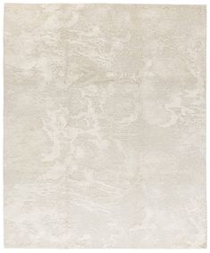 a white rug with an abstract design on the top and bottom part of it's surface