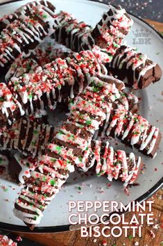 peppermint chocolate biscotti cookies on a plate with sprinkles