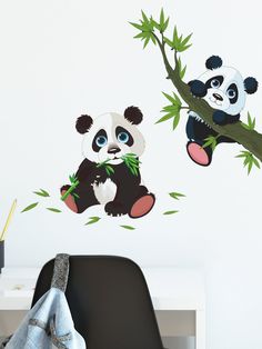 two pandas eating bamboo leaves on a branch wall sticker set in a room