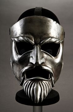 an image of a metal mask with a beard on it's head and the caption