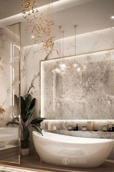 an elegant bathroom with marble walls and flooring, gold trimming on the bathtub