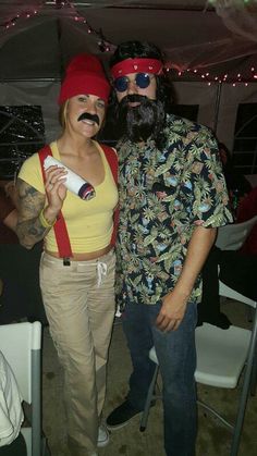 a man and woman dressed up in costumes