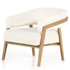 an upholstered chair with wooden legs and a white fabric seat pad on the back