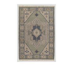 a beige and blue rug with an intricate design on the bottom, in front of a white background