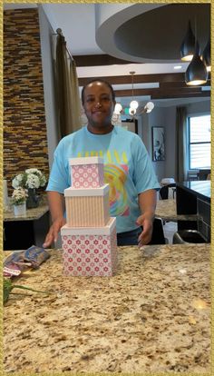 a man standing in front of a cake on top of a counter