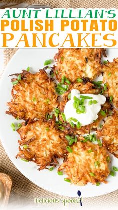 an image of a plate of potato pancakes with sour cream and chives on top