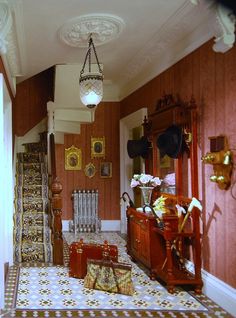 the hallway is decorated with antique furniture and decor